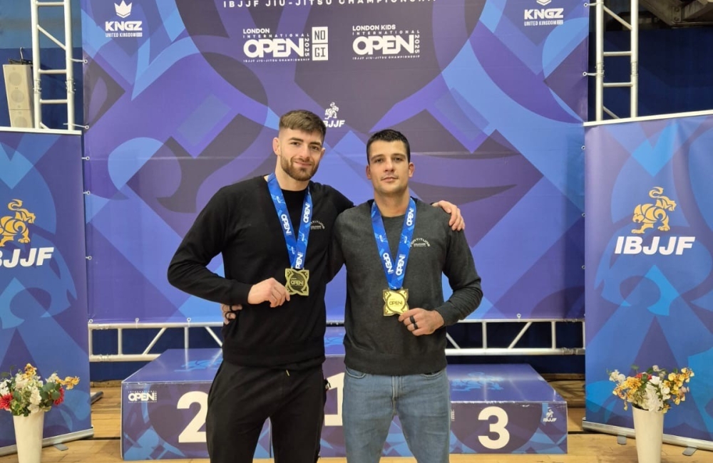 Corey Kent with a friend holding a medal