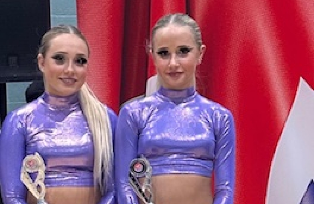 Isabel and Jasmine holding trophies