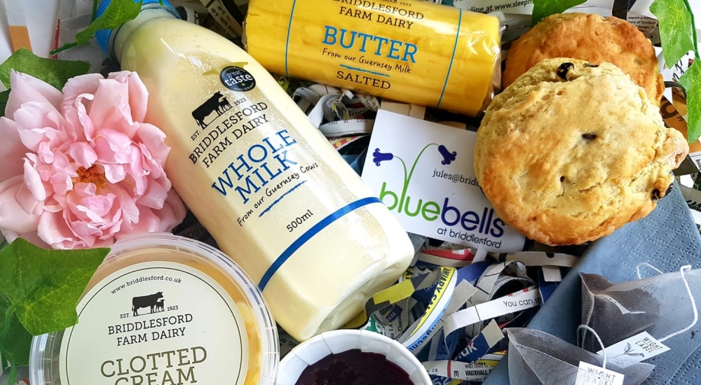 a selection of briddlesford farm products, including salted butter, clotted cream, and whole milk